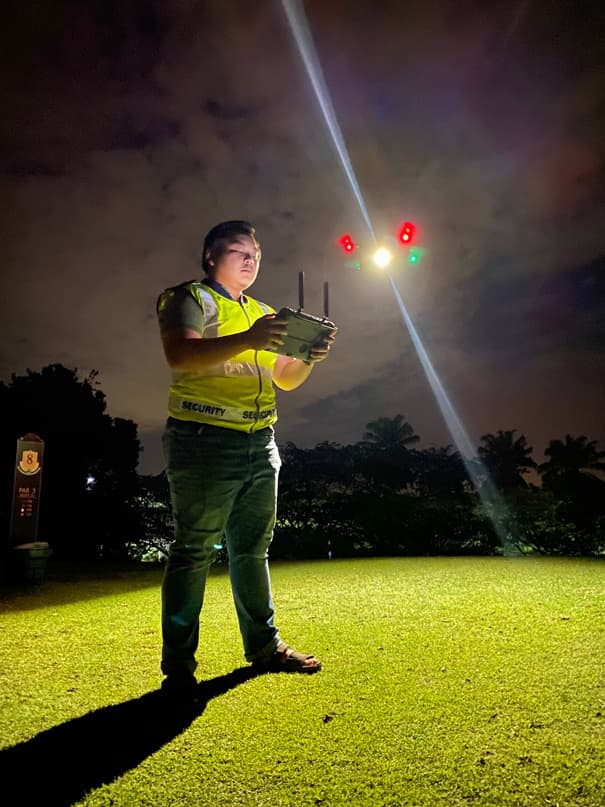 Taqwa Teguh officer operating surveillance equipment at night